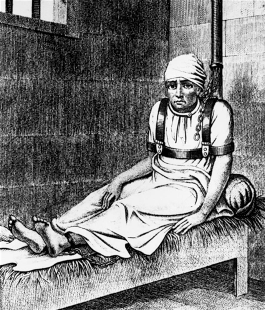 A black and white painting of a patient sitting on a chair with belts fastened from hands, chest, and hands, to the chair and a tranquilizing machine around the head.